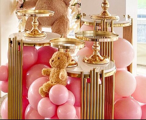 Rustic wooden food stands and serving displays for a catered reception