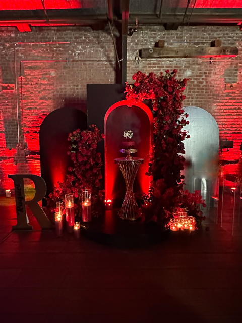 Warm-tone uplighting transforming the walls of an event venue