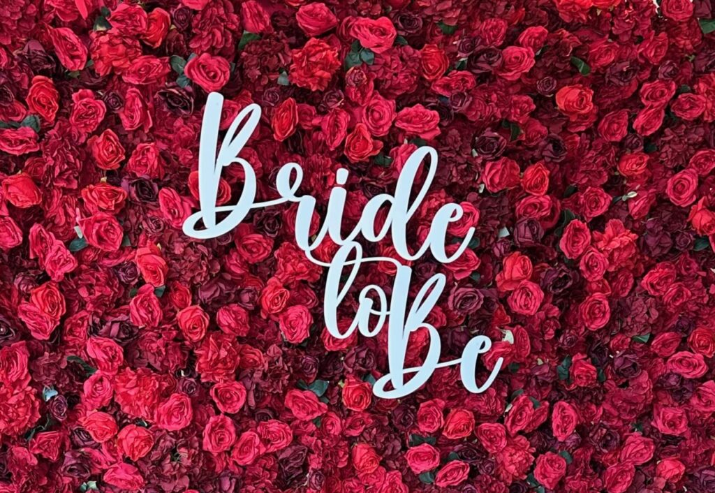 Custom laser-cut acrylic signage for a wedding welcome display