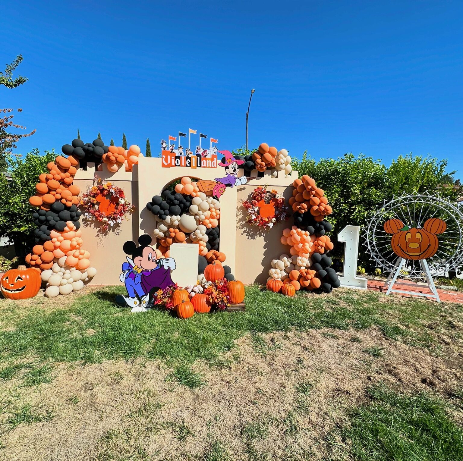 Signature Disney Cars inspired birthday theme with custom backdrop, props, and coordinated florals